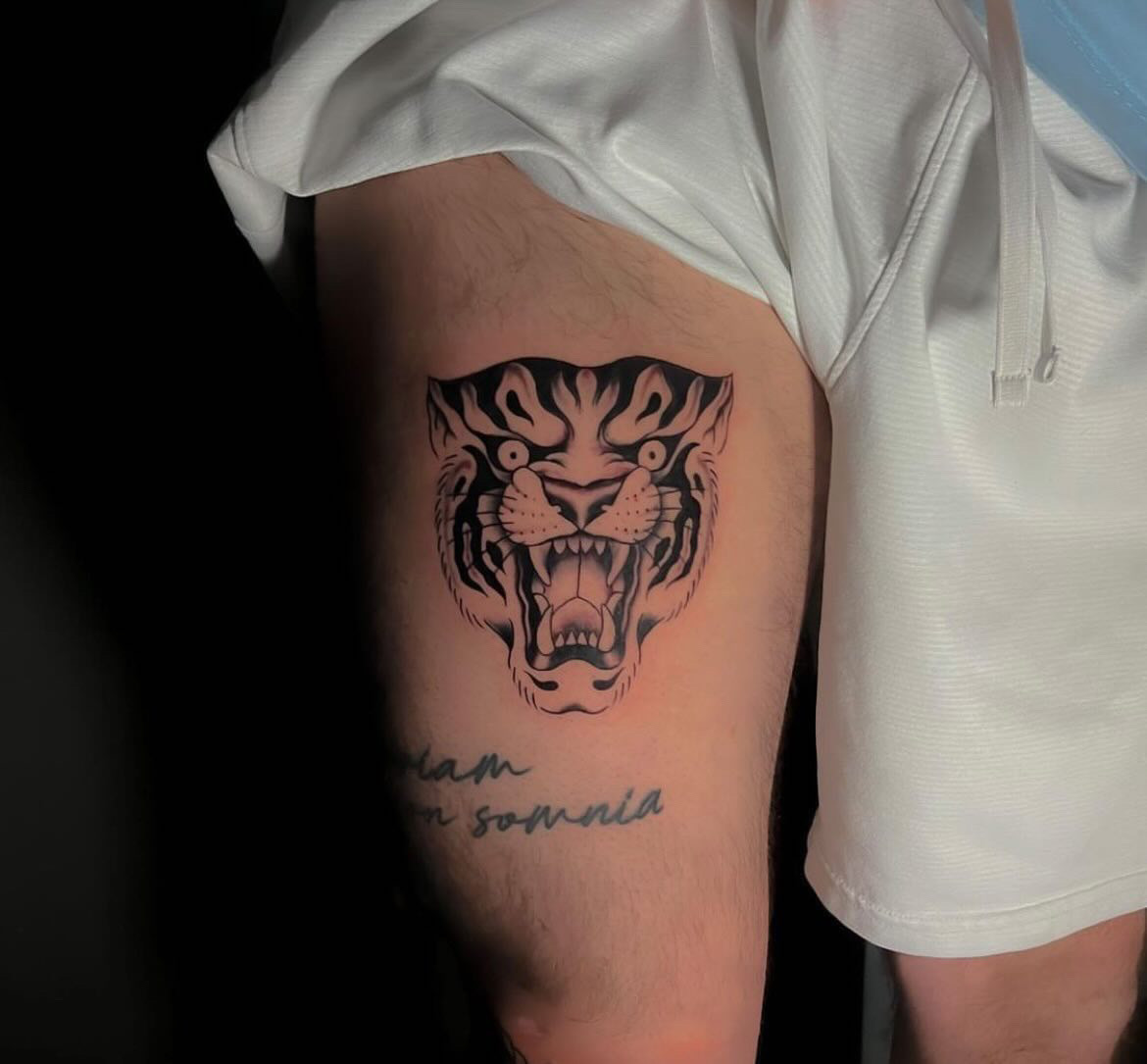 Tigers Head thigh tattoo by tattoo artist Alessandra Clivio of Sacred Mandala Studio.